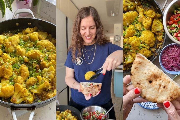 כרובית רכה מוכנה בסיר, לצד פיתה, סלט בצל עם סומק, וסלט ירקות.