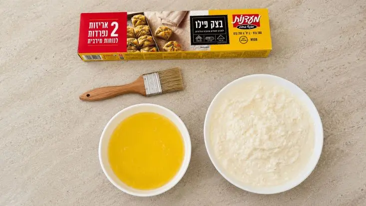 חמאה מומסת, בצק פילו ומלית גבינות.